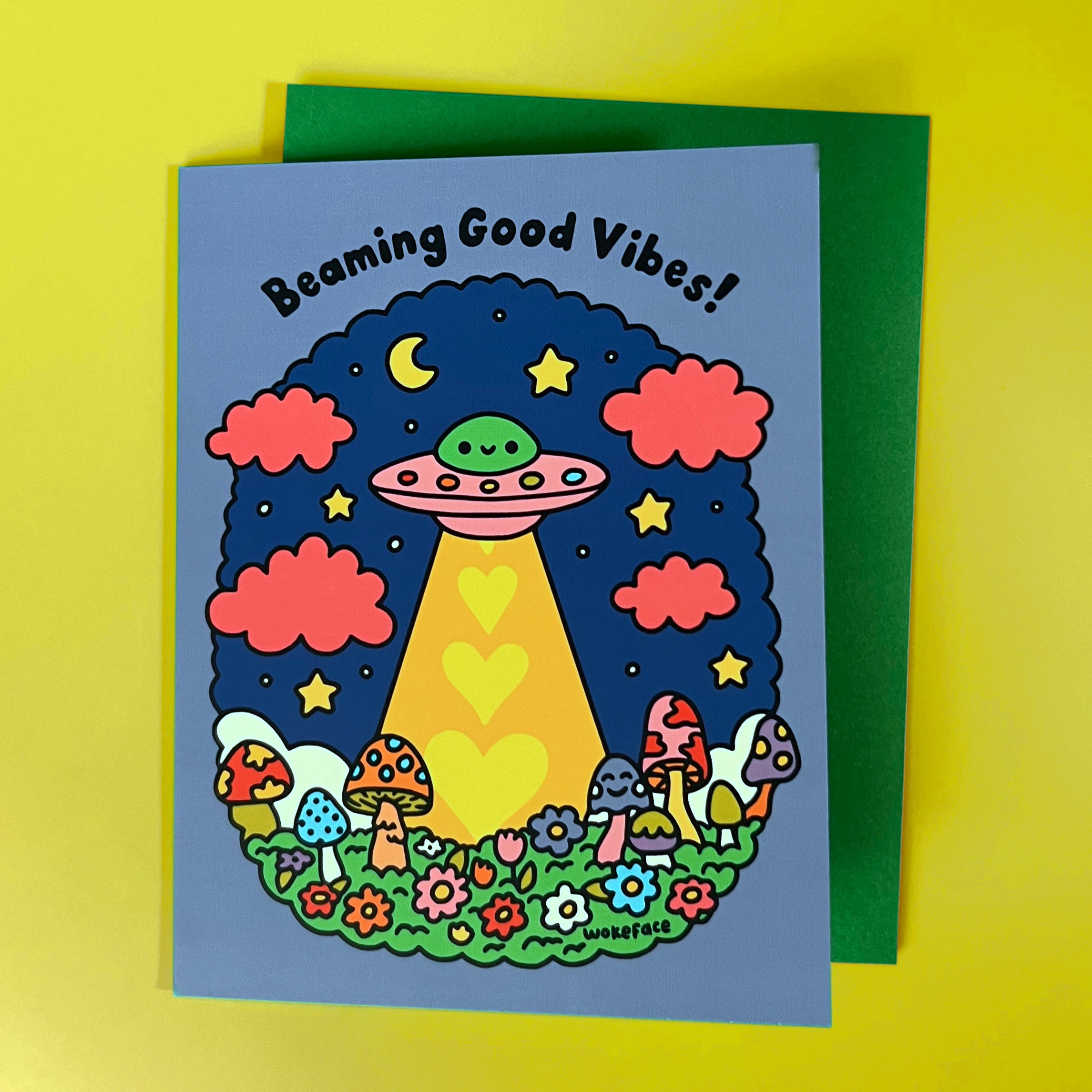 Colorful greeting card with UFO and mushrooms design with the tagline "Beaming Good Vibes!"