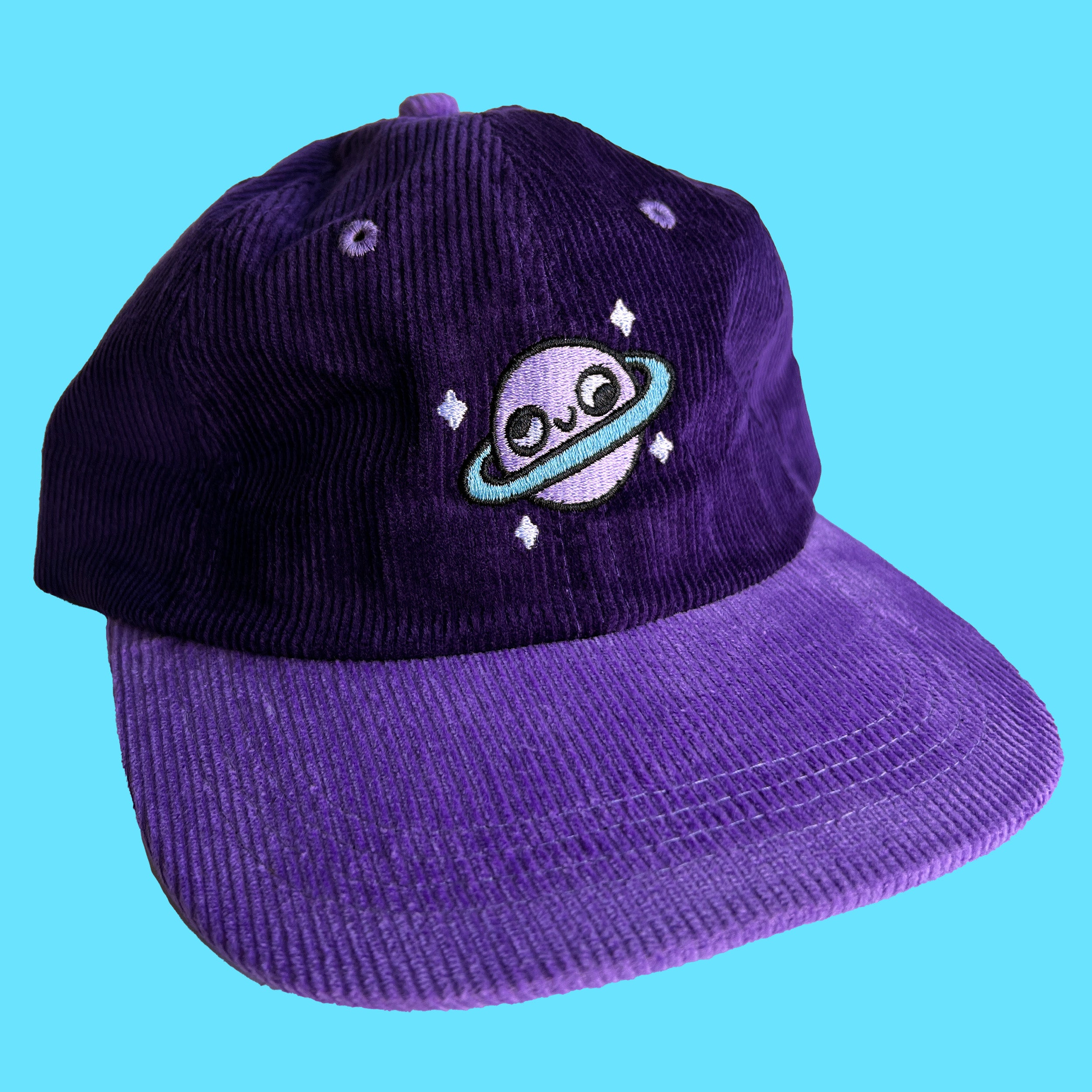 Gorra de pana con planeta retrógrado