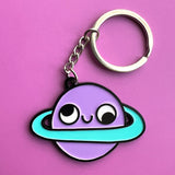 Llavero de planeta retrógrado